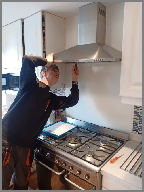 Kitchen hood installer in Oxford preparing commercial extraction canopy